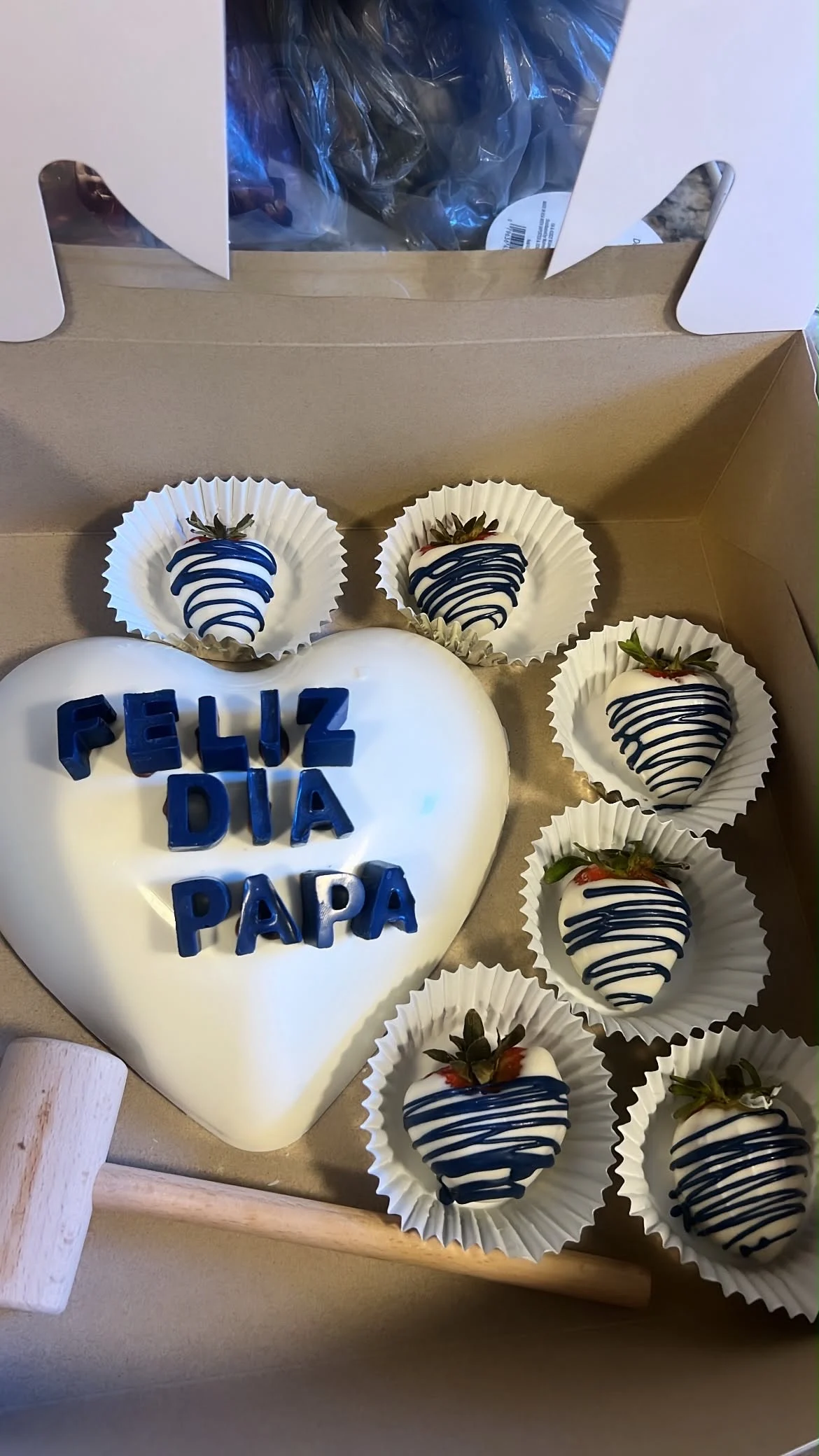 Blue and white Father’s Day heart cake with matching strawberries